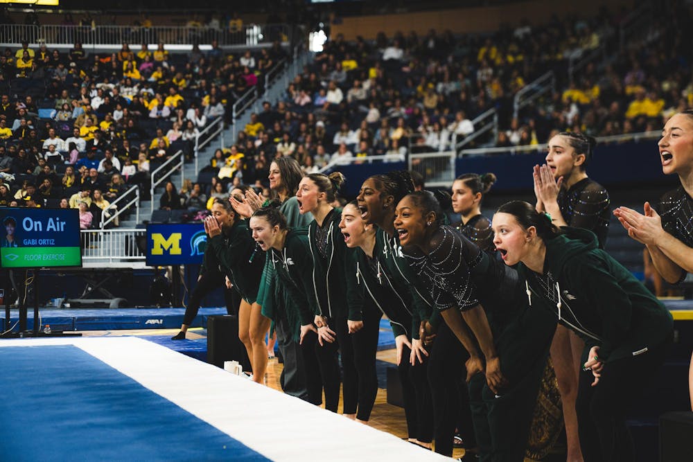 MSU Women's Gymnastics team celebrates at the Crisler Center in Ann Arbor, MI, on Feb. 01, 2026.
