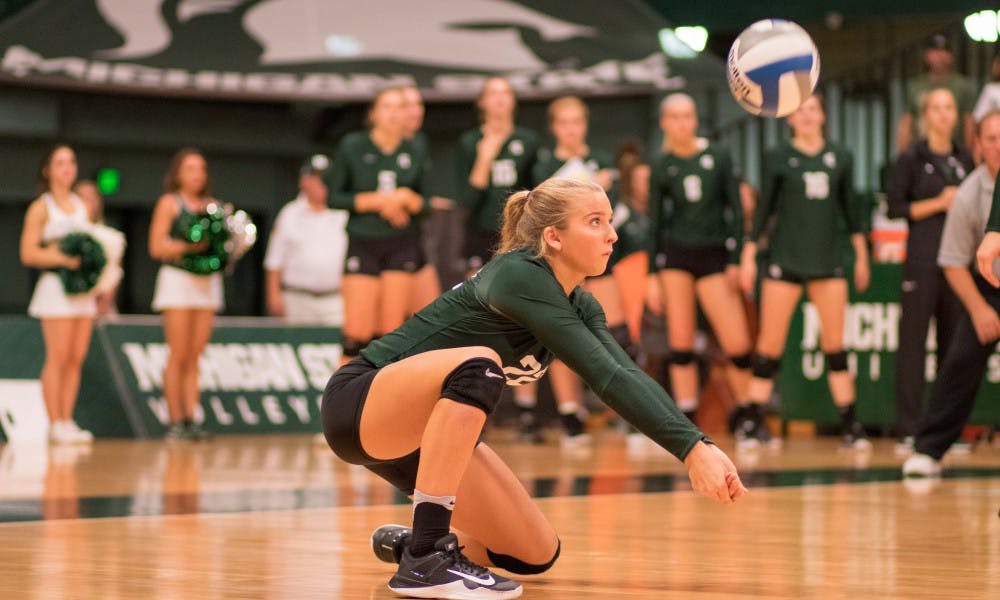 Sophomore defensive specialist Samantha McLean (22) passes a ball during the game against Corpus Christi. The Spartans defeated the Islanders, 3-0.