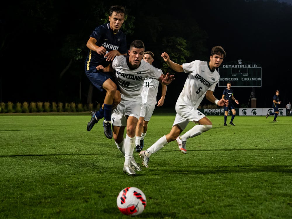 Graduate Student Midfielder Michael Miller fights for position on the ball as it rolls toward the sideline. The Spartans fell to the Zips 2-1, on Aug. 30, 2021. 