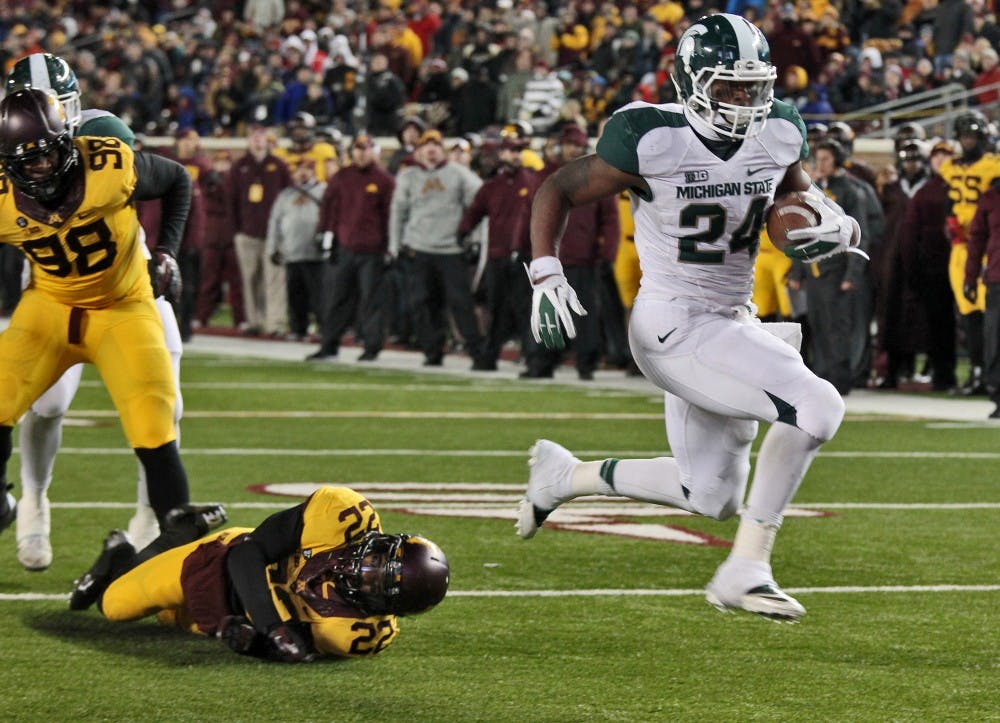 	<p>Junior running back Le&#8217;Veon Bell jumps into the end zone, leaving would-be Minnesota tacklers in his wake, on an 8-yard touchdown run in the fourth quarter at <span class="caps">TCF</span> Bank Stadium in Minneapolis, Minn. <span class="caps">MSU</span> won, 26-10, as Bell rushed for a career-high 266 yards on 35 carries on Saturday, Nov. 24, 2012. Martin Levison/Minneapolis Star Tribune/MCT</p>