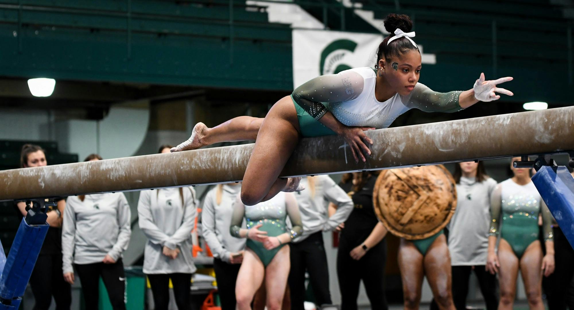 <p>Freshman Nyah Smith during her balance beam event at the gymnastics meet at Jenison Field House on February 16, 2020. The Spartans took the win over the Fighting Illini. </p>