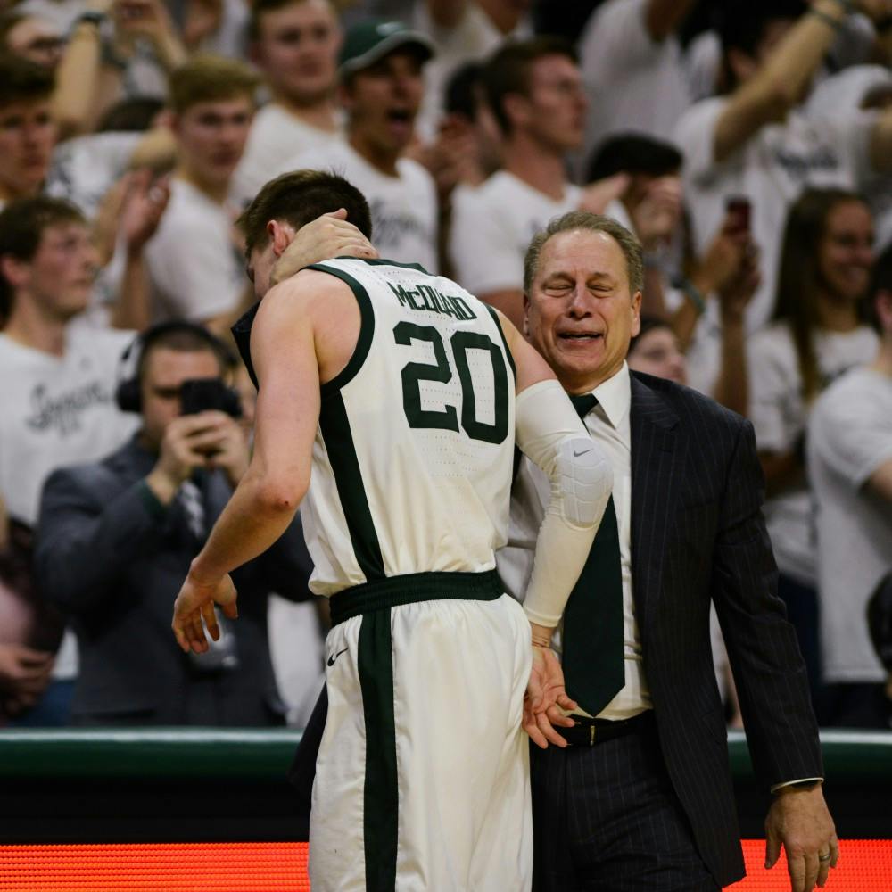 Senior forward Matt McQuaid (20) walks off the court as Head Coach Tom Izzo reacts to his performance during the game against Michigan at Breslin Center March 9, 2019. The Spartans defeated the Wolverines, 75-63.