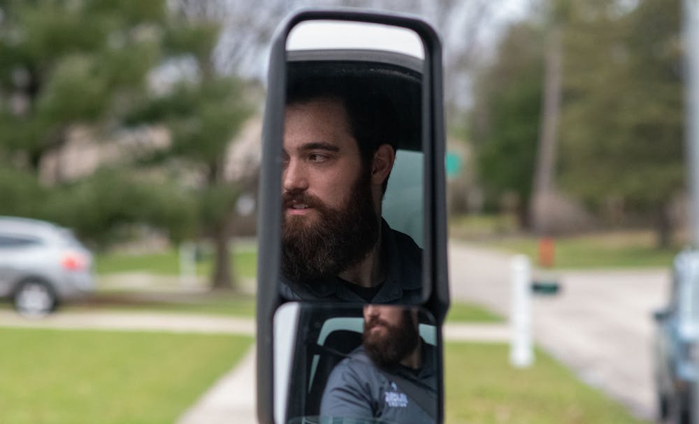 Colin DeGarmo looks out his window to get instructions on how to act for the Valkyrie Movers training video on April 7, 2022. 