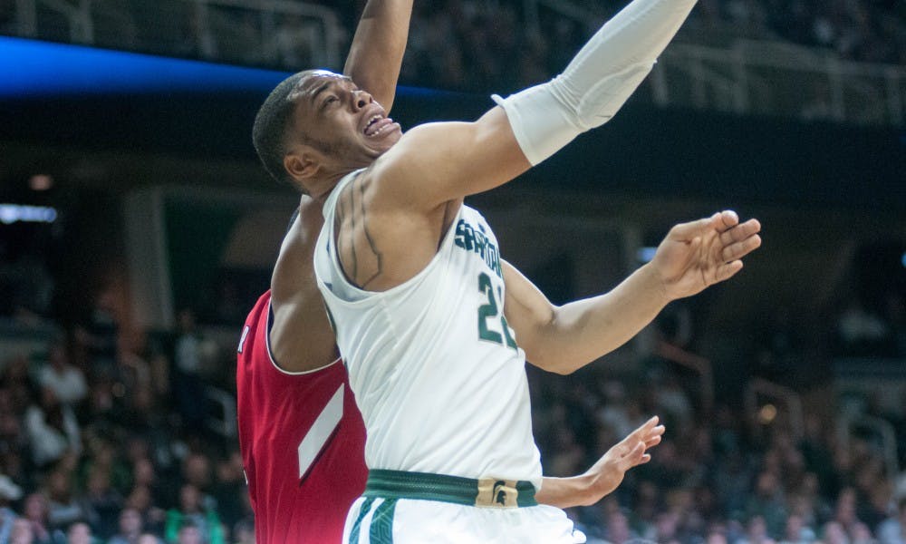 Sophomore guard and forward Miles Bridges (22) takes a shot during the game against Nebraska on Dec. 3, 2017, at Breslin Center. The Spartans defeated the Cornhuskers 86-57.