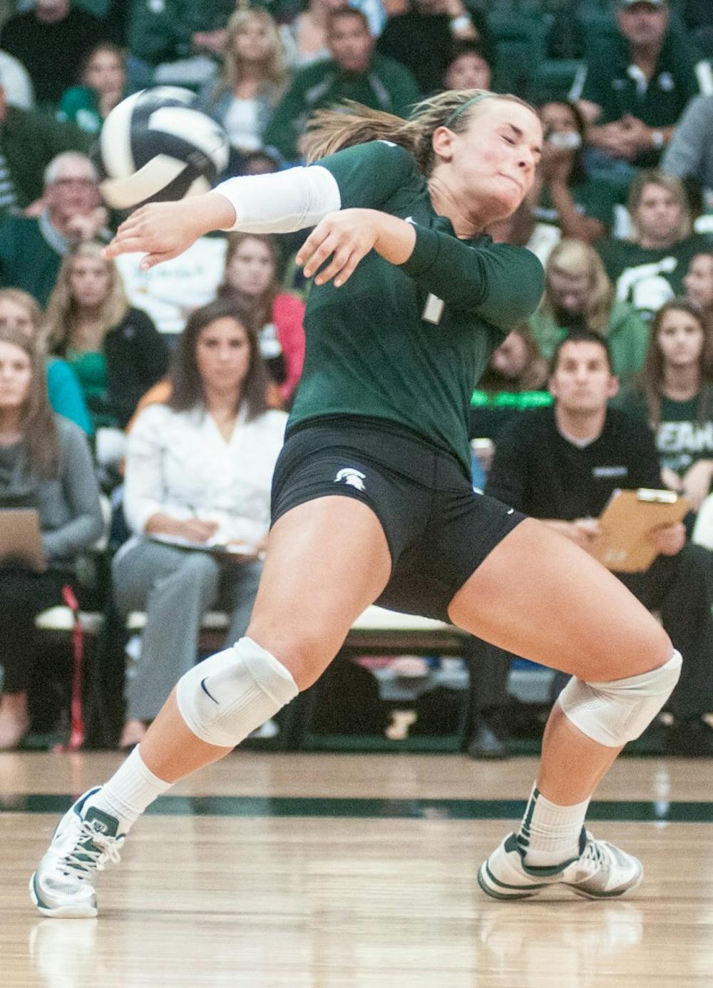 The ball hits libero Kori Moster during the game against Purdue on Friday, Sept. 21, 2012. The Spartans lost against No. 17 Purdue 3-2. Julia Nagy/The State News