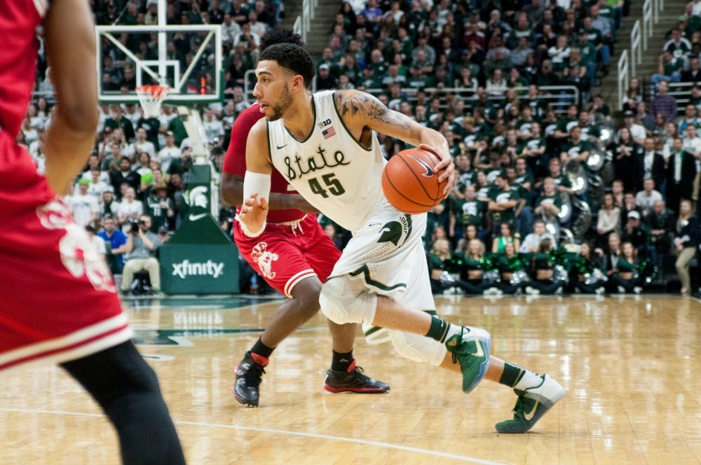 Senior guard Denzel Valentine dribbles the ball during the second half of the game against Wisconsin on Feb.18, 2016 at Breslin Center. The Spartans defeated the Badgers, 69-54.