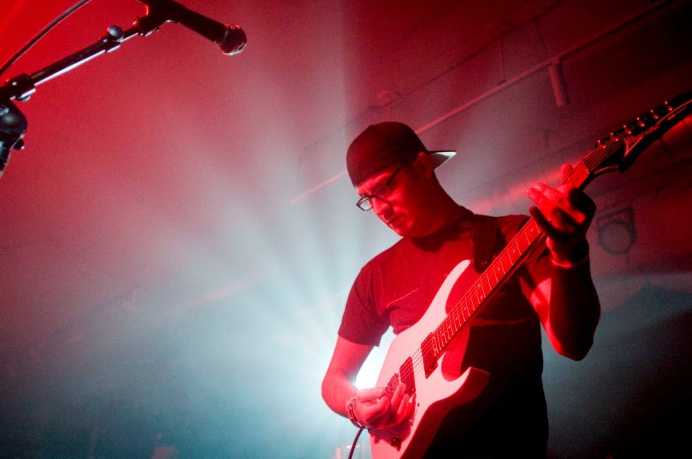 Lead guitarist, Chas Millican, of the hard rock/metal band Deveraux, plays guitar Friday night at The Loft, 414 E. Michigan Ave., in Lansing. The band performed and filmed its first music video after winning the Q106 Homegrown Throwdown. Samantha Radecki/The State News