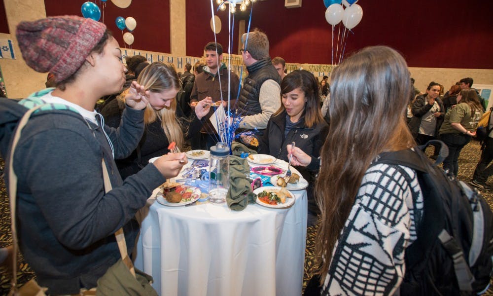 <p>Left to right, anthropology sophomore Breanna Escamilla, anthropology senior Marissa Palys, anthropology senior Ashley Start and anthropology and human biology junior Christiana Hench eat during Israel fest on Nov. 10, 2015 at the Union.</p>