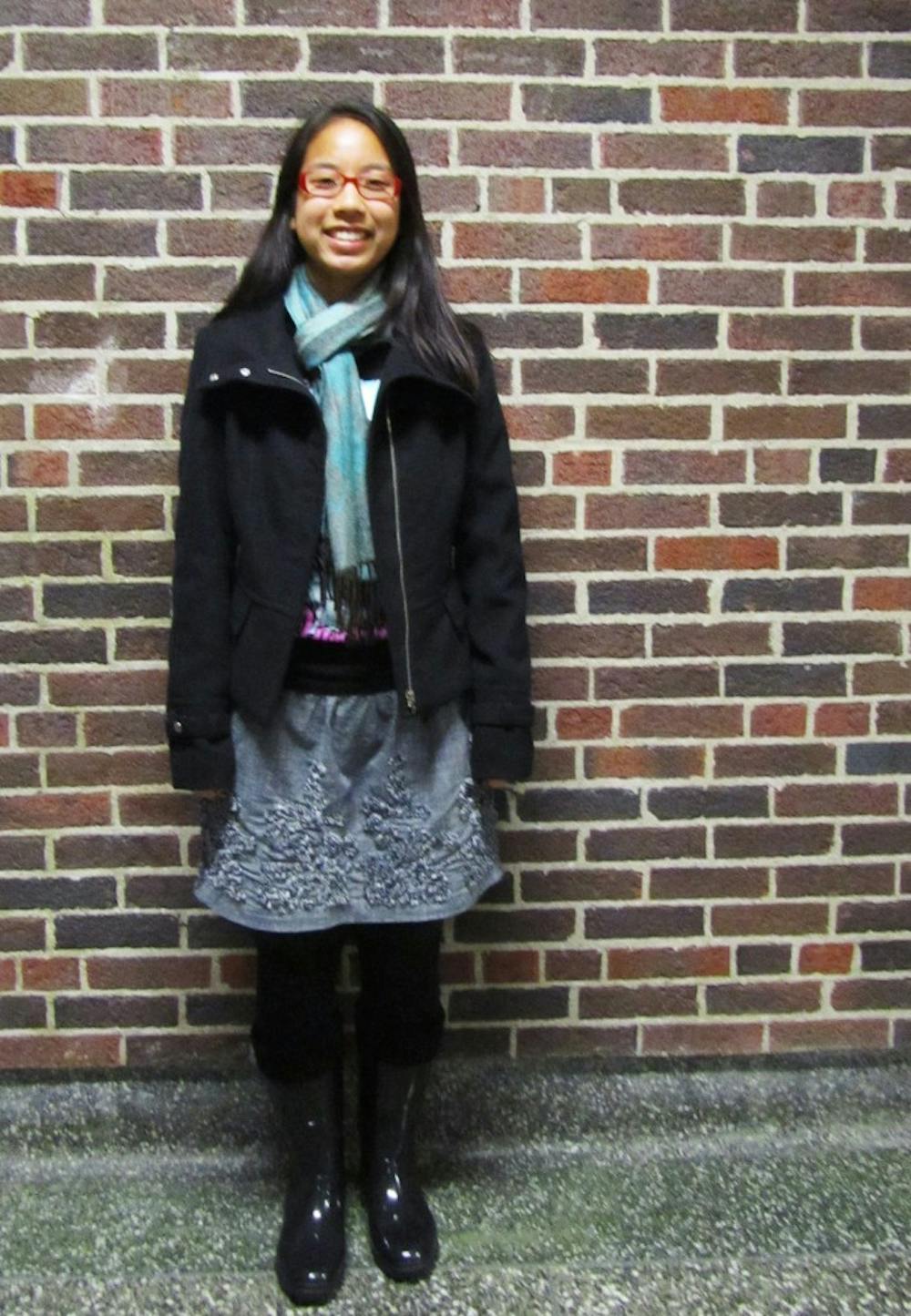 	<p>Linguistics sophomore Michelle Terazawa braves the wet weather in a classic black coat and rain boots.</p>