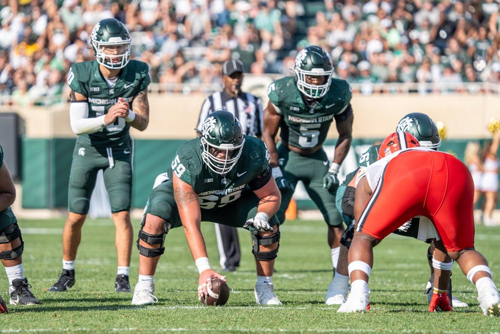 <p>Redshirt senior center Nick Samac (59) is about to snap the ball during a game against Maryland at Spartan Stadium on Sept. 23, 2023. The Spartans are losing to the Terrapins 21-3 at halftime.</p>