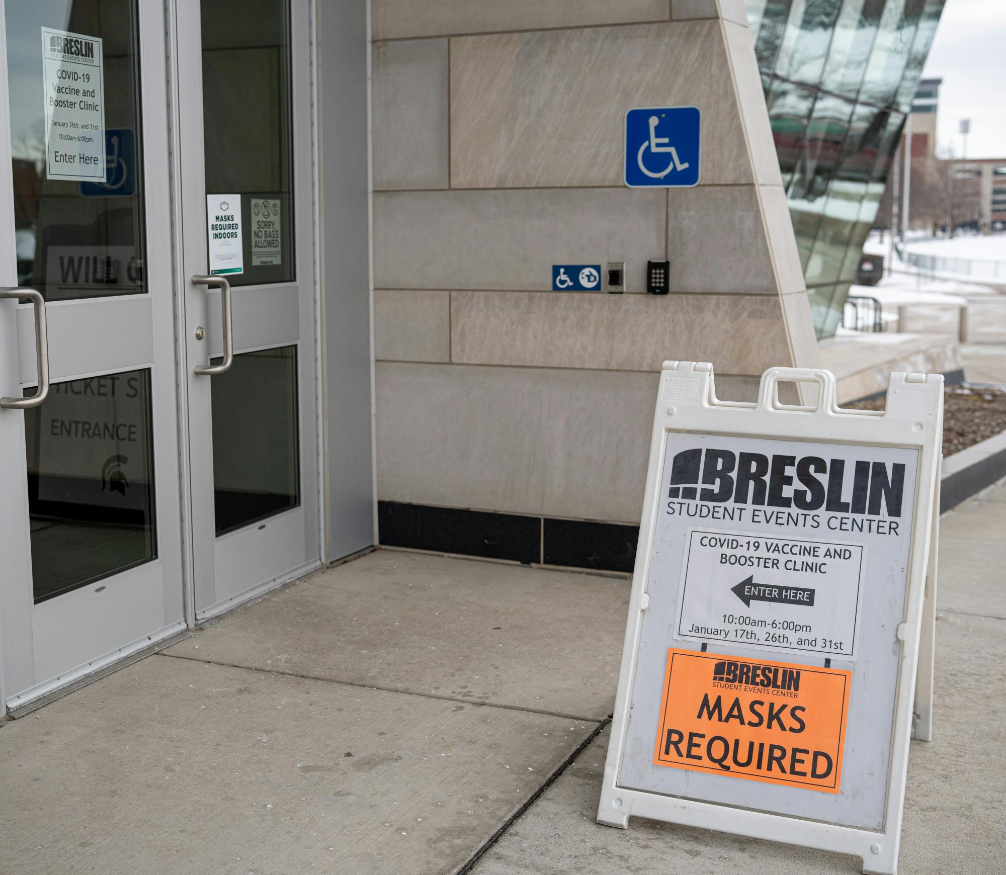 <p>A sign sits at the entrance of the Breslin Center, guiding students and the public inside, as it holds a COVID-19 vaccine clinic on Jan. 26, 2022.</p>