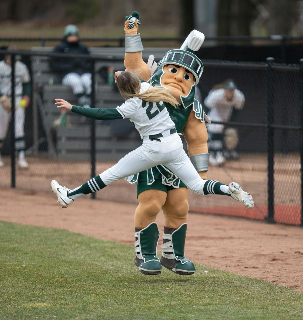 <p>Sparty decides to have some fun by taking outfielder Mackenzie Meech&#x27;s beanie before their intense game against Ohio State on April 1, 2022. </p>