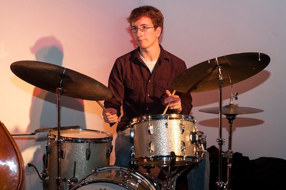 	<p>Jazz studies senior Nate Woodring plays drums at a jazz concert Nov. 6, 2013, at (<span class="caps">SCENE</span>) Metrospace, 110 Charles St. Tonight was the first time that the Nate Woodring Trio performed together for a gig. Margaux Forster/The State News</p>