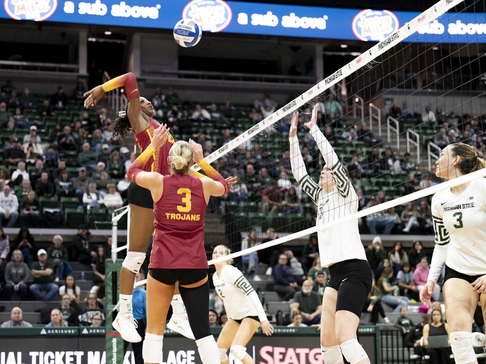 USC senior middle blocker Rylie McGinest (22) scores the point during the volleyball match against Michigan State at the Breslin Center on Wednesday, Nov. 26, 2025.