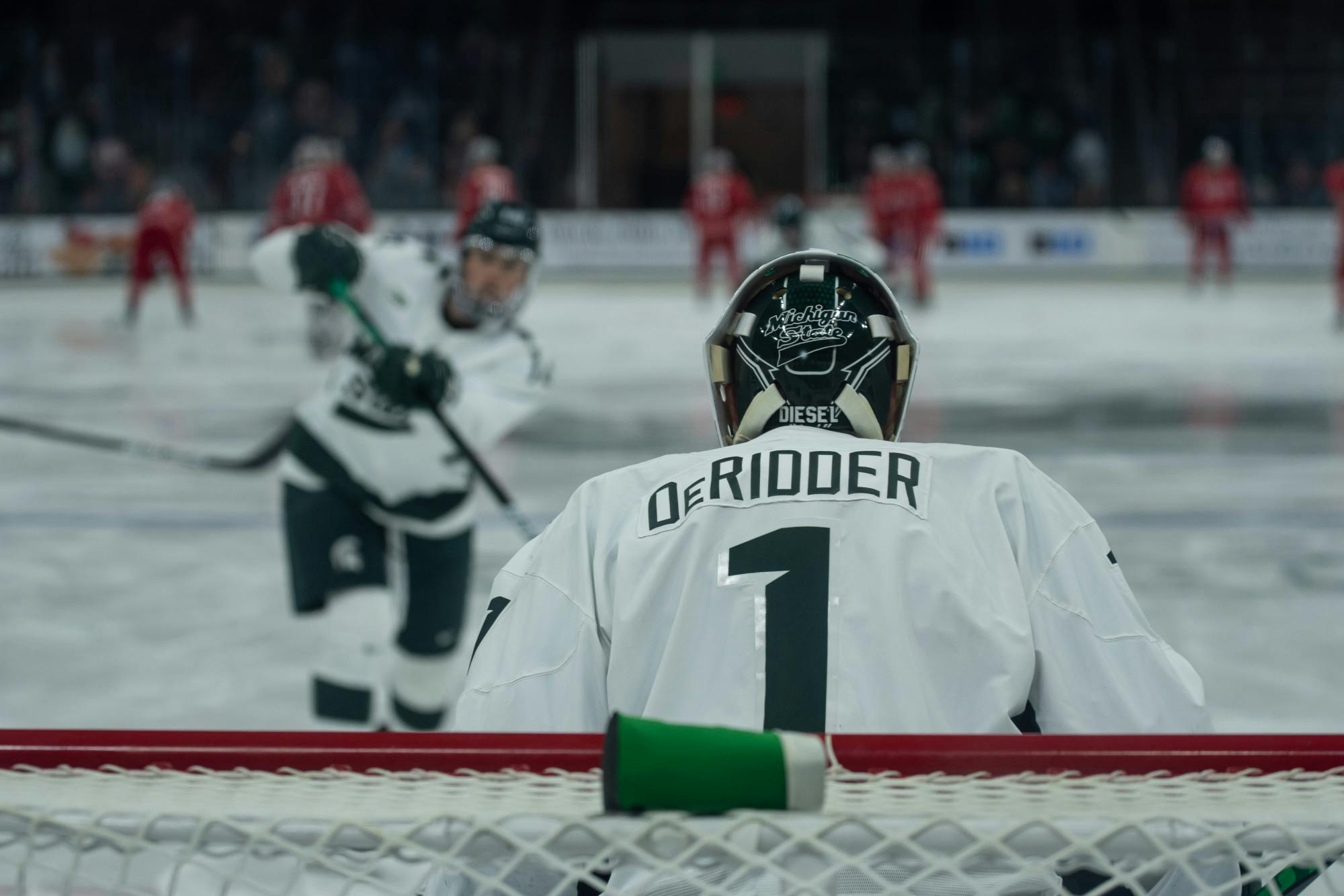 <p>Junior goaltender Drew DeRidder warms up prior to the Spartans’ matchup with Ohio State on Jan. 24. DeRidder held the Buckeyes to no goals in the Spartans 2-0 victory. </p>