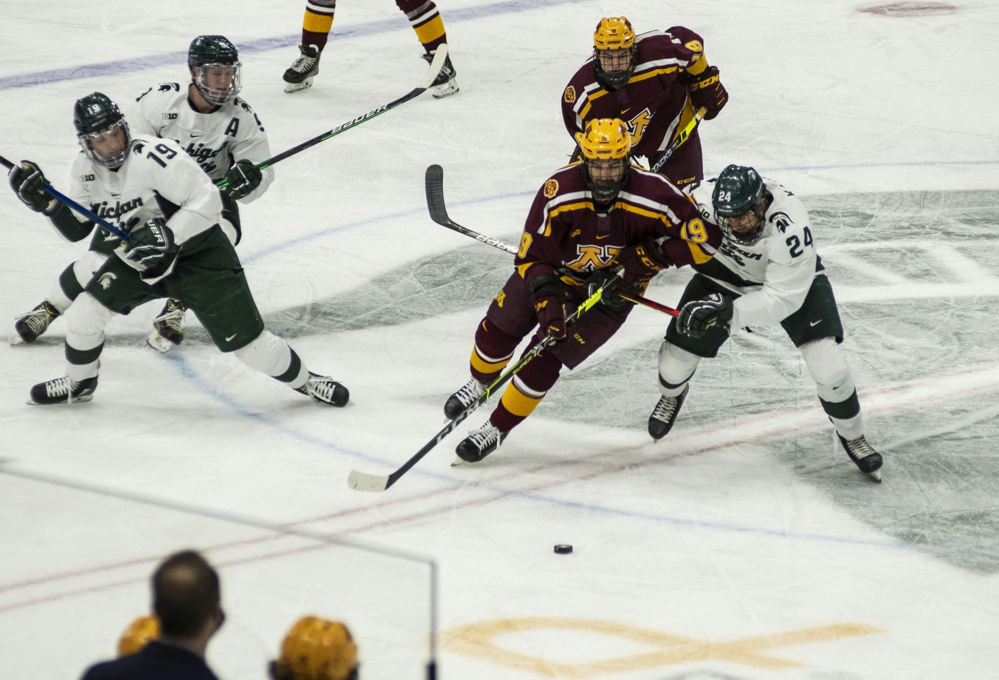 <p>Senior forward Austin Kamer (24) skates towards the puck after a face-off in the second period. The Spartans fell to the Golden Gophers, 3-1, on Dec. 3, 2020.</p>