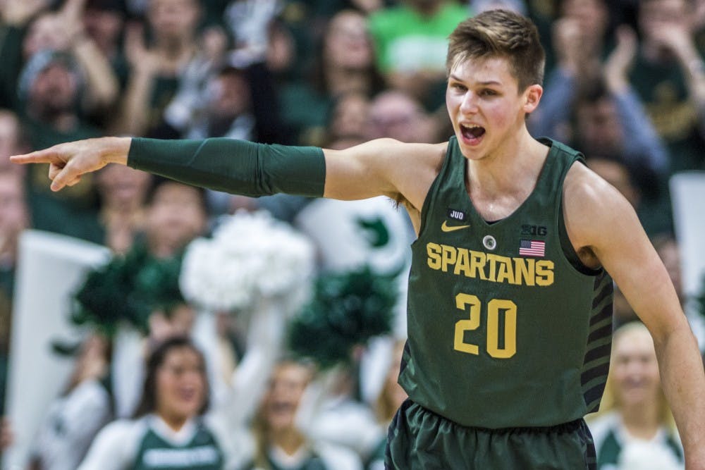 Junior guard Matt McQuaid (20) expresses emotion during the men's basketball game against Maryland on Jan. 4, 2018 at Breslin Center. The Spartans defeated the Terrapins, 91-61. (Nic Antaya | The State News)