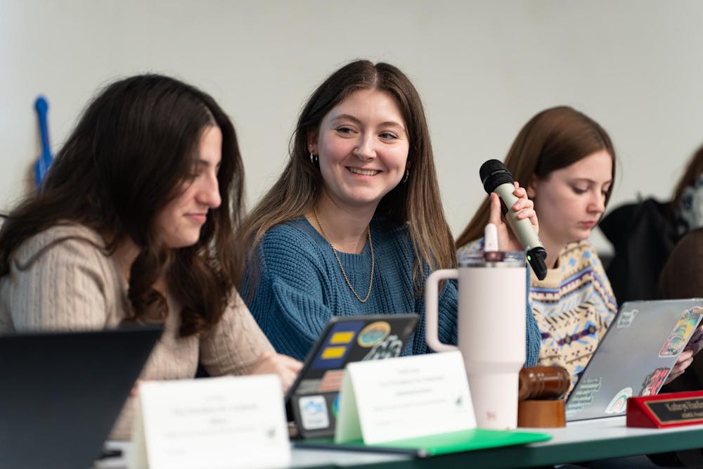 <p>ASMSU President Kathryn Harding smiles as she presents to the General Assembly at the International Center in East Lansing, Michigan on Jan. 22nd, 2026.</p>