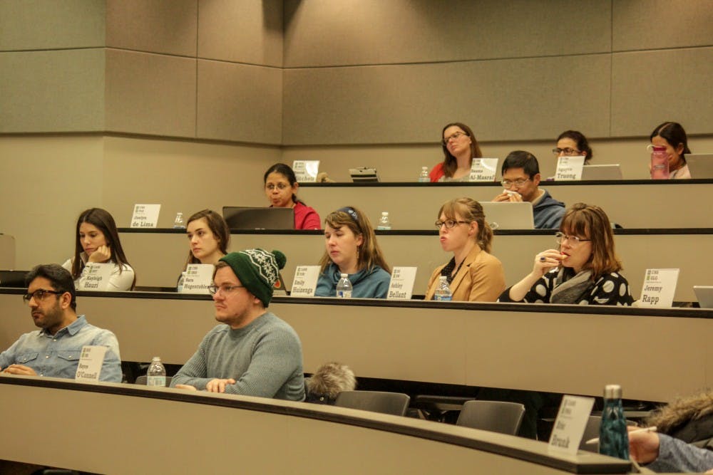 Members listen at a COGs meeting in the Law College on Feb. 13, 2019.