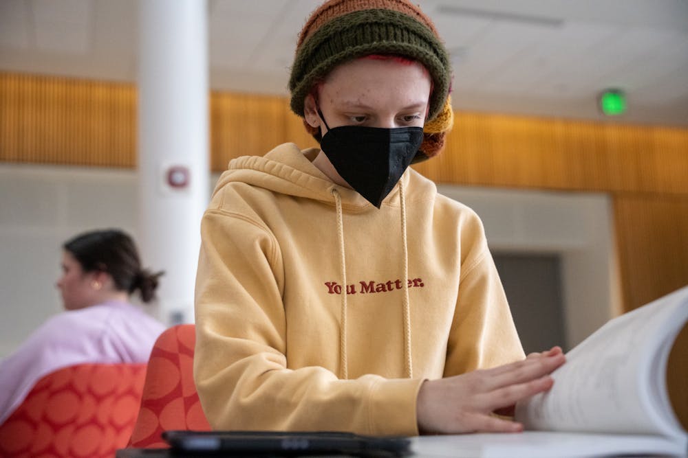 Political Science sophomore Cora Fontana does homework in the Minskoff Pavilion on March 30, 2023.