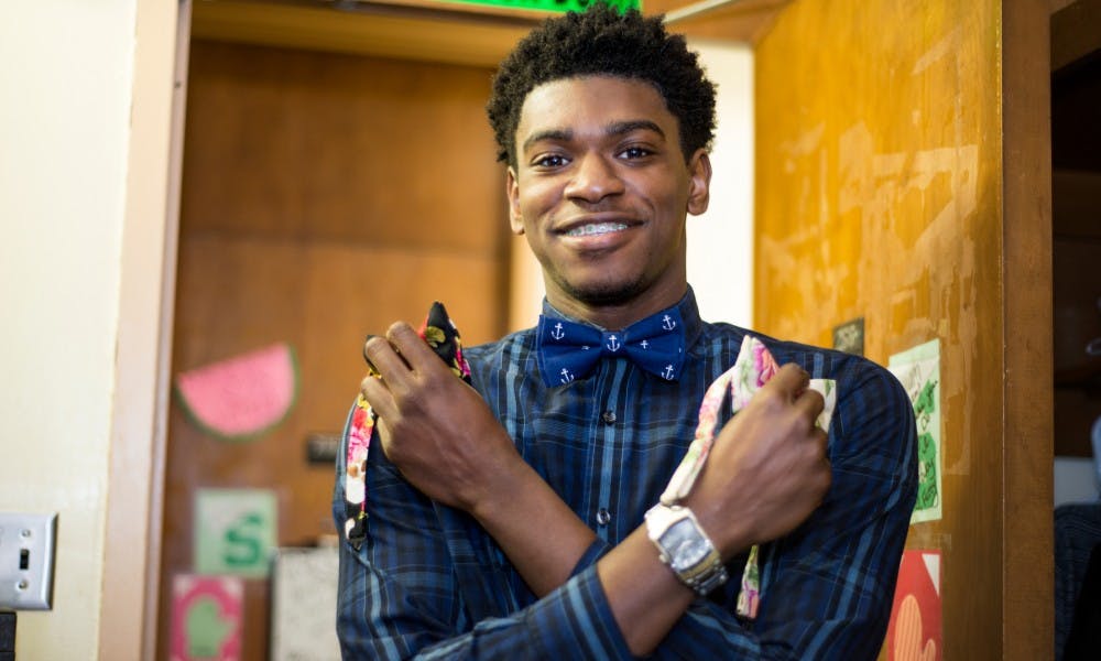 Business freshman William Murphy holds two bowties on March 18, 2016 at East McDonel Hall. Murphy has been running his bowtie business, Reign Bow Ties, for almost a year. Murphy's mother makes all of the bowties by hand with a cotton and linen blend fabric.