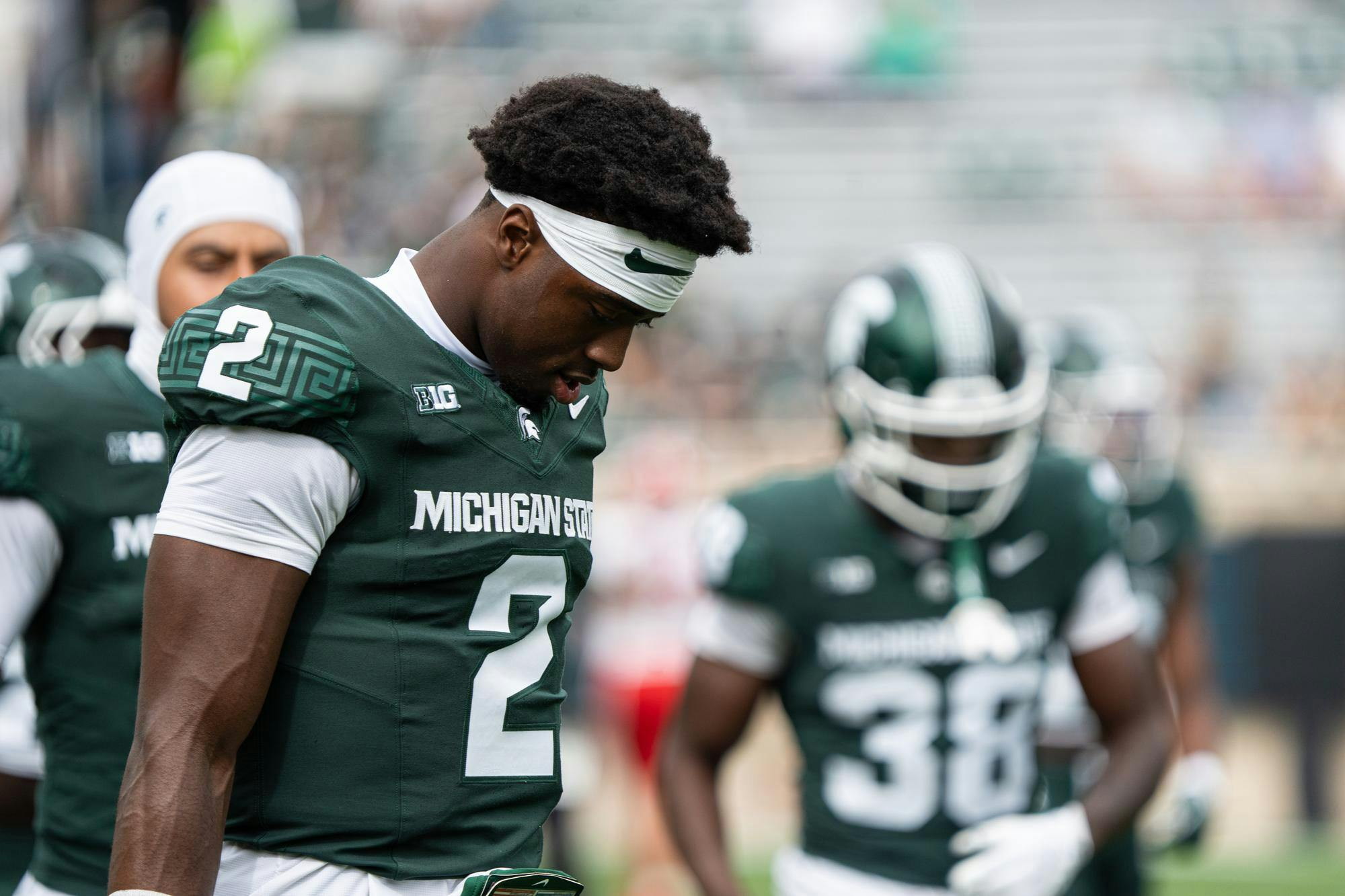 Quarterback Aiden Chiles (2) warming up.