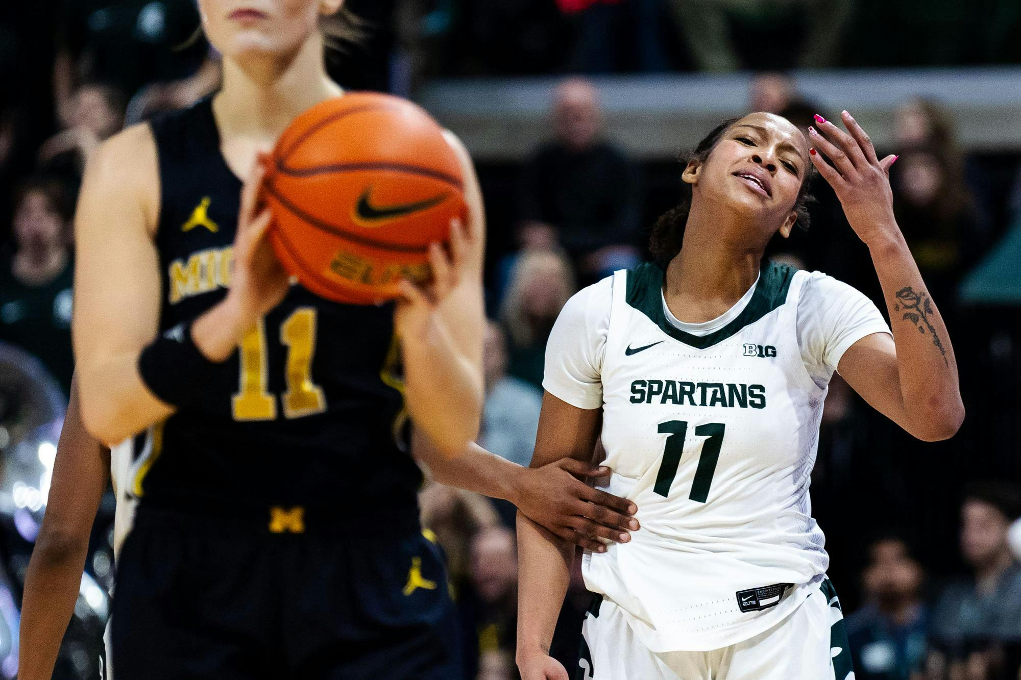 <p>Michigan State senior forward Jocelyn Tate (11) reacts after a referee makes a call at the Breslin Center on Feb. 9, 2025. MSU fell to Michigan with a final score of 71-61.</p>