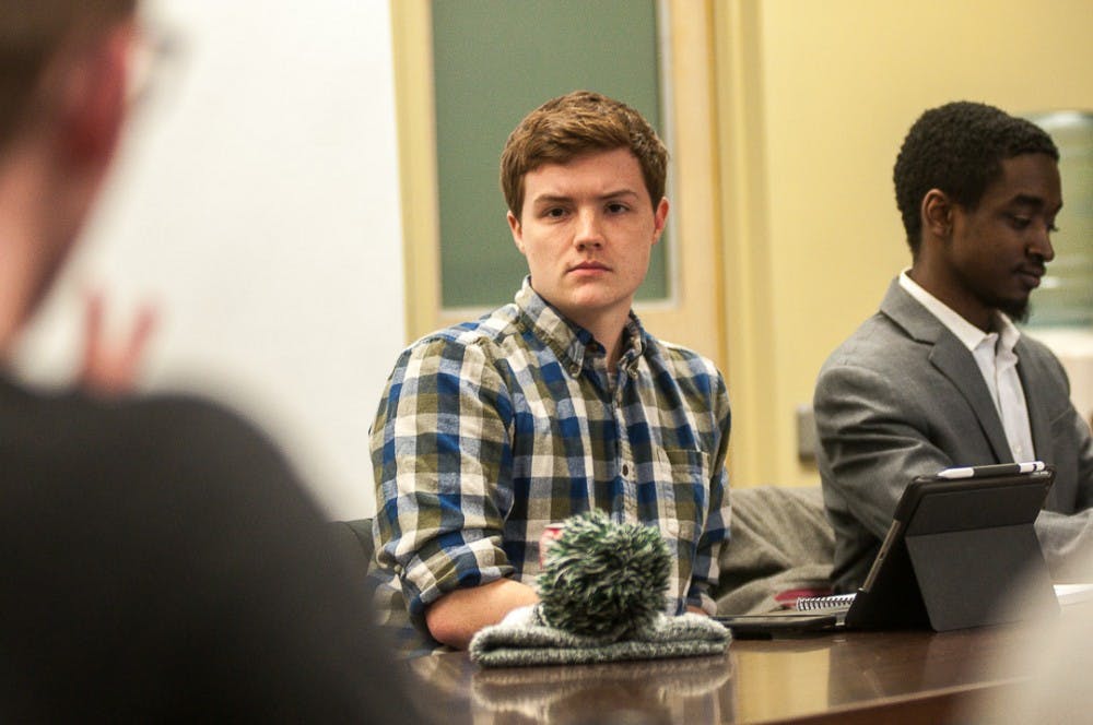 ASMSU Representative Ben Horne listens during an ASMSU meeting on Jan. 24, 2019, at the Student Services Building.