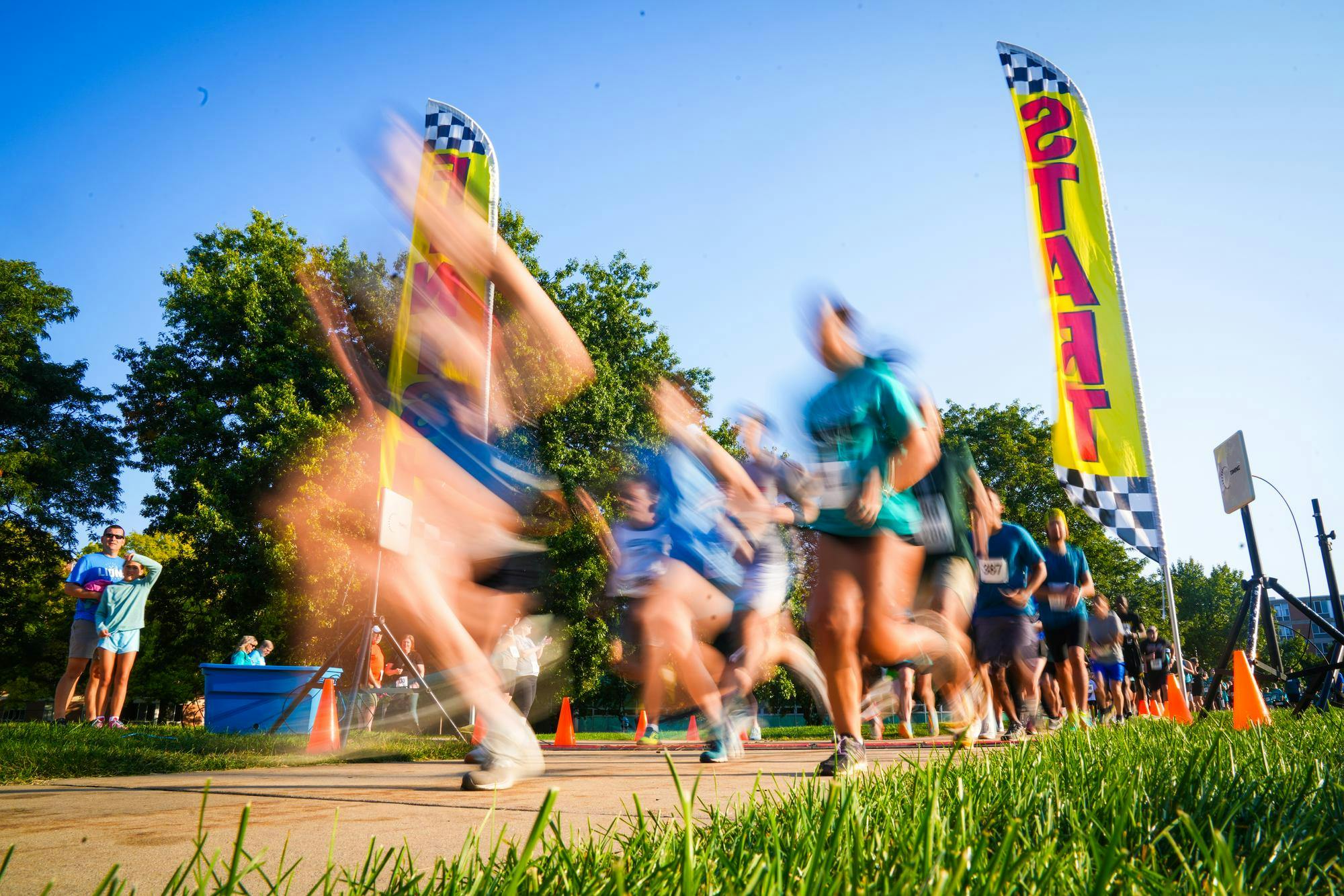 Participants race through the starting line during the Big Babies 5k Run at Conrad Hall on Sep. 15, 2024. The 5k is a charity event aiming to provide financial support for animals that require treatment through MSU's Veterinary Medical Center. Participants of all ages were encouraged to join, and were also allowed to bring their dogs.