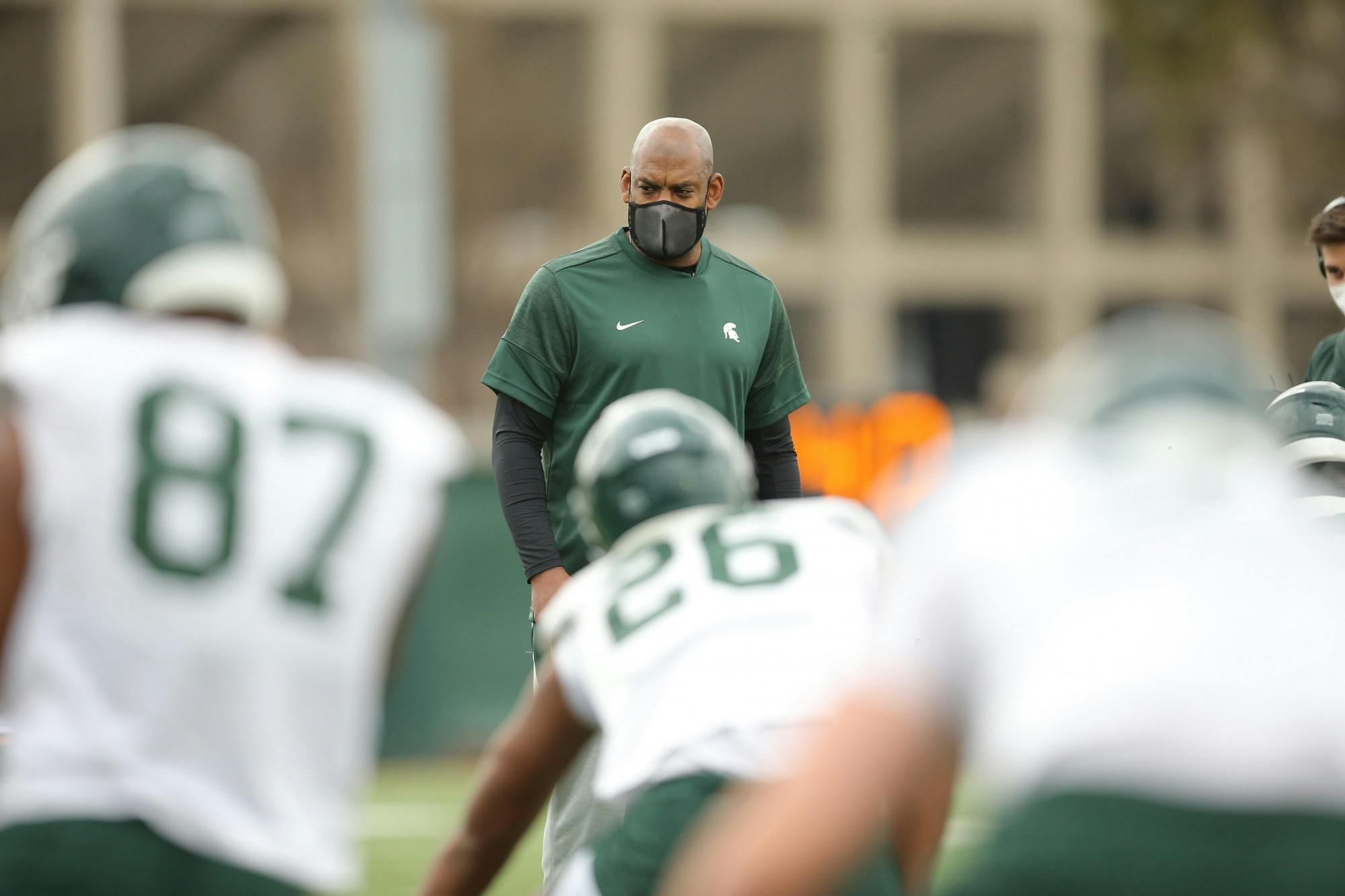 <p>Coach Mel Tucker watches during the Spartans&#x27; opening day of spring ball on March 23, 2021, at the MSU football practice facility. Photo courtesy of MSU Athletic Communications.</p>