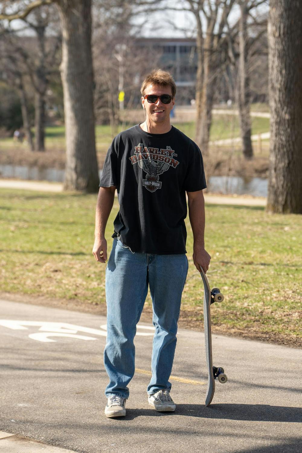 Chase Banas, social chair of MSU Skate Club, poses for a portrait during the beginning of skate club outside of Shaw Hall on Michigan State University’s campus in East Lansing, Mich., on March 20, 2026. Banas said he has met some of his closest friends through the Michigan skate community.