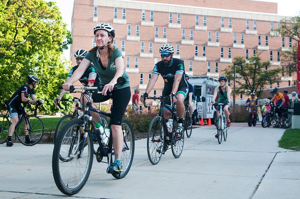 <p>Bikers embark on their trip during the Ride of Silence on May 21, 2014, outside Wells Hall. The group rode their bikes from Wells Hall to the Michigan State Capitol. Corey Damocles/The State News</p>