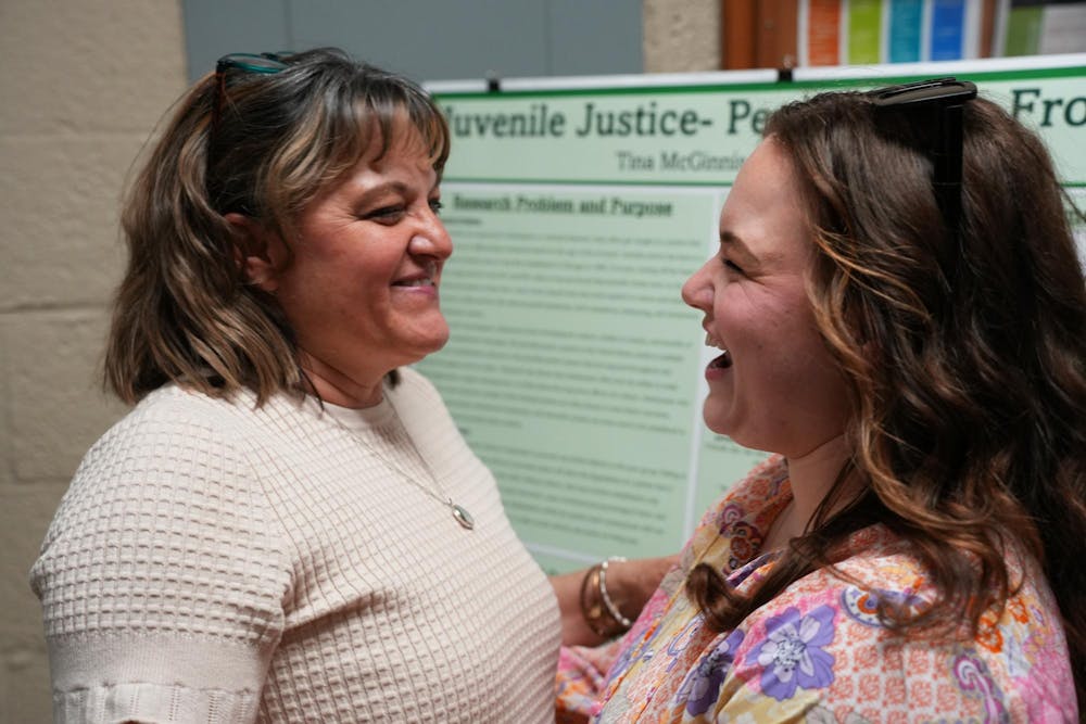 <p>Michigan State interdisciplinary social sciences senior, Tina McGinnis is given a surprise visit from her daughter, Molly during her capstone presentation at Berkey Hall on April 19, 2024.</p>