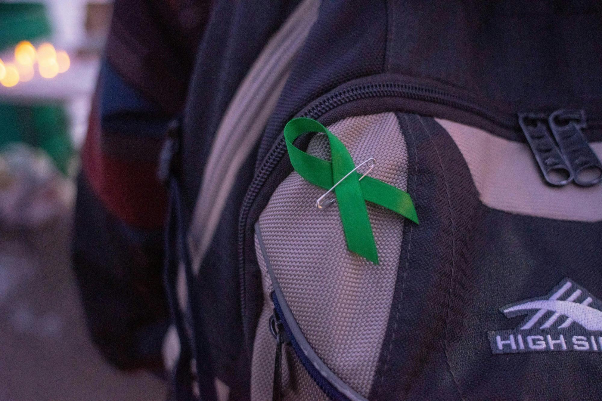 A pin at a candlelight vigil for ASMSU’s Mental Health Awareness Week on Nov. 11, 2019.