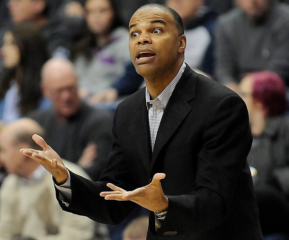 <p>Harvard head coach Tommy Amaker talks to his players during the first half of a game against Connecticut at Gampel Pavilion in Storrs, Conn., on Jan. 8, 2014. (John Woike/Hartford Courant/MCT)</p>