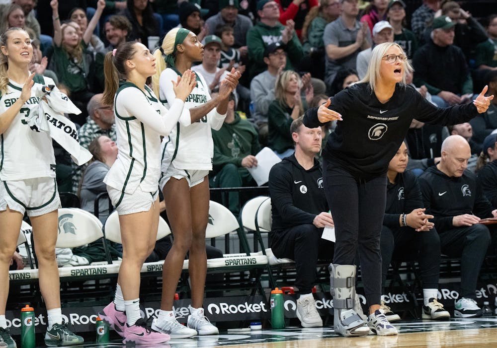 The MSU women’s basketball bench celebrates after a basket during the matchup against USC at the Breslin Center on Jan. 22, 2026.
