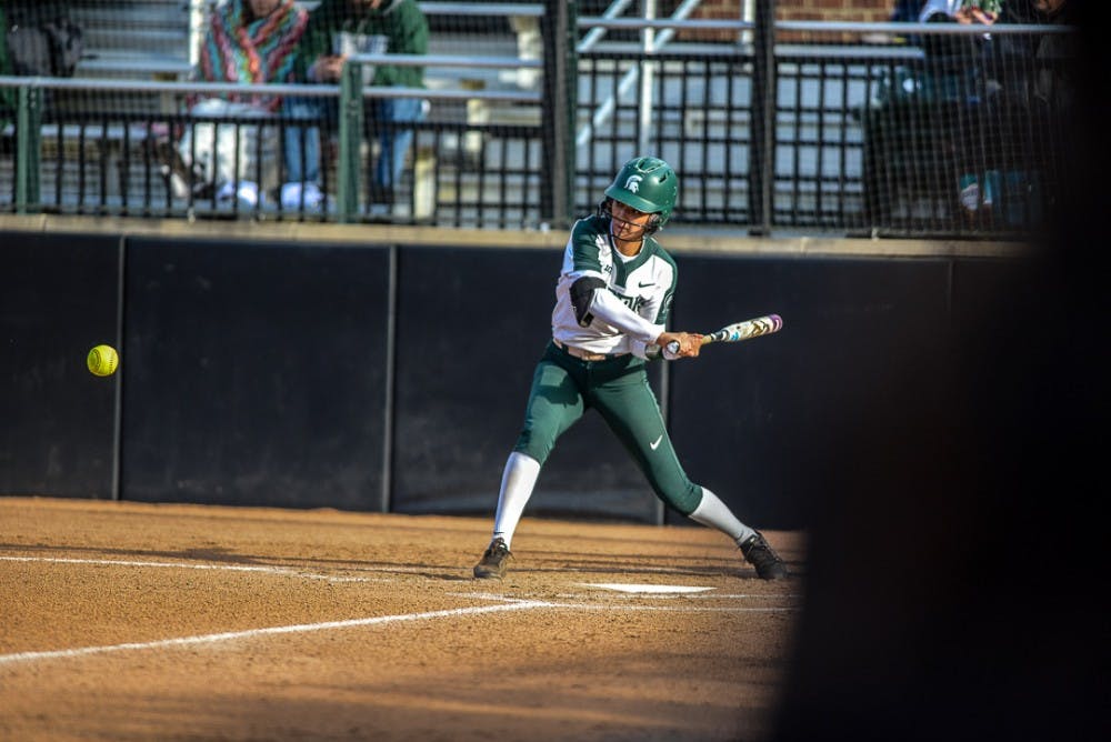 <p>Junior second baseman Melanie Baccay (21) hits the ball during the game against Oakland on April,3, 2019 at Secchia Stadium. The Spartans beat the Golden Grizzlies, 11-3. </p>