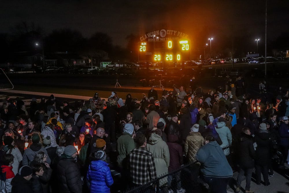 Family, friends and the Clawson community gather for a candlelight vigil to honor Alexandria Verner, a victim of MSU's mass shooting, at Clawson High School's Football Field on Feb. 15, 2023, two days after the mass shooting at MSU. 