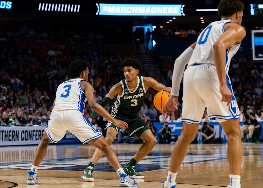 <p>Sophomore guard Jeremy Roach (3) defends against freshman guard Jaden Akins (3) during Duke&#x27;s victory over Michigan State on March 20, 2022.</p>