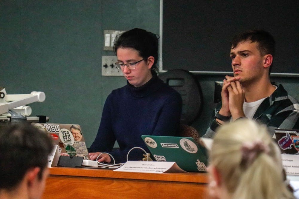 Vice President of Governmental Affairs Maysa Sitar, left, and Vice President for Student Allocations Dylan Catalano, right, listen at the ASMSU meeting on Oct. 3, 2019.