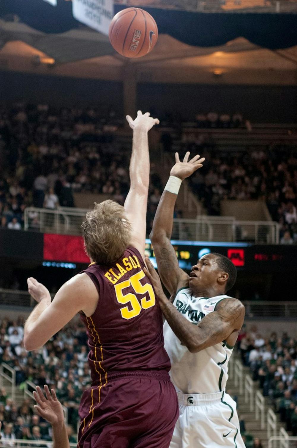 	<p>Senior guard Keith Appling guards Minnesota center Elliott Eliason on Jan. 11, 2014, at the Breslin Center. The Spartans defeated the Gophers in overtime, 87-75. Betsy Agosta/The State News</p>