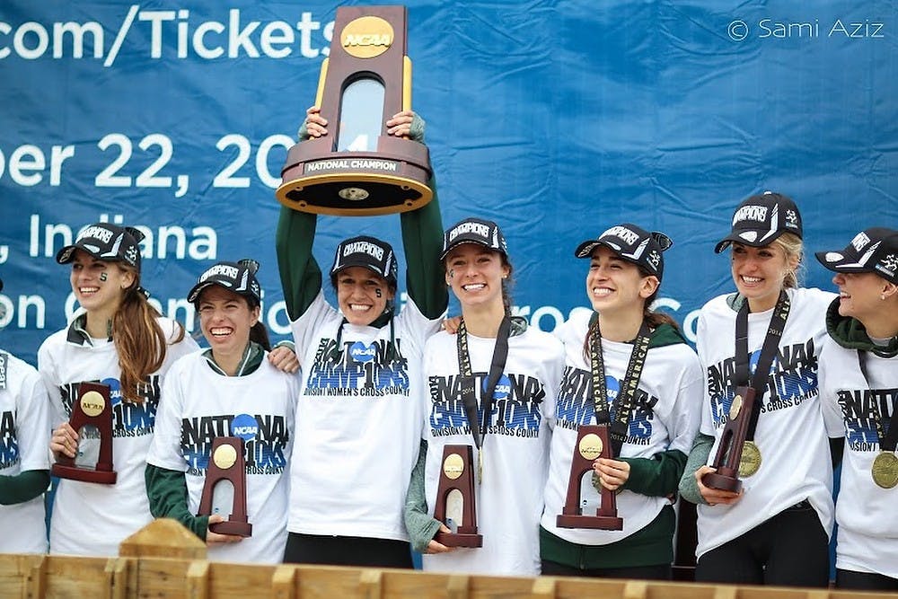 <p>The MSU women's cross country team celebrates the 2014 National Championship on Nov. 22, 2014, after the meet at LaVern Gibson Championship Cross Country Course in Terre Haute, Indiana. It was MSU's first women's cross country national championship victory.</p>