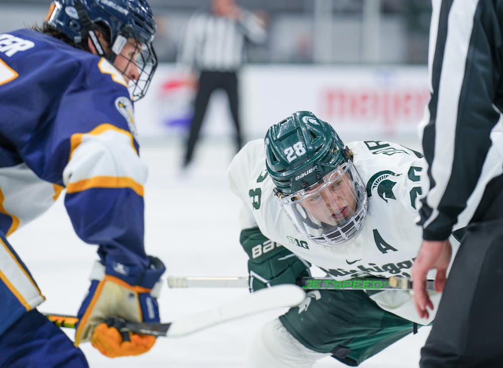 <p>Sophomore forward Karsen Dorwart (28) before the puck is dropped during a game against Canisius at Munn Ice Arena on Oct. 19, 2023. The Spartans beat the Griffins 6-3 in one of a two-game series.</p>