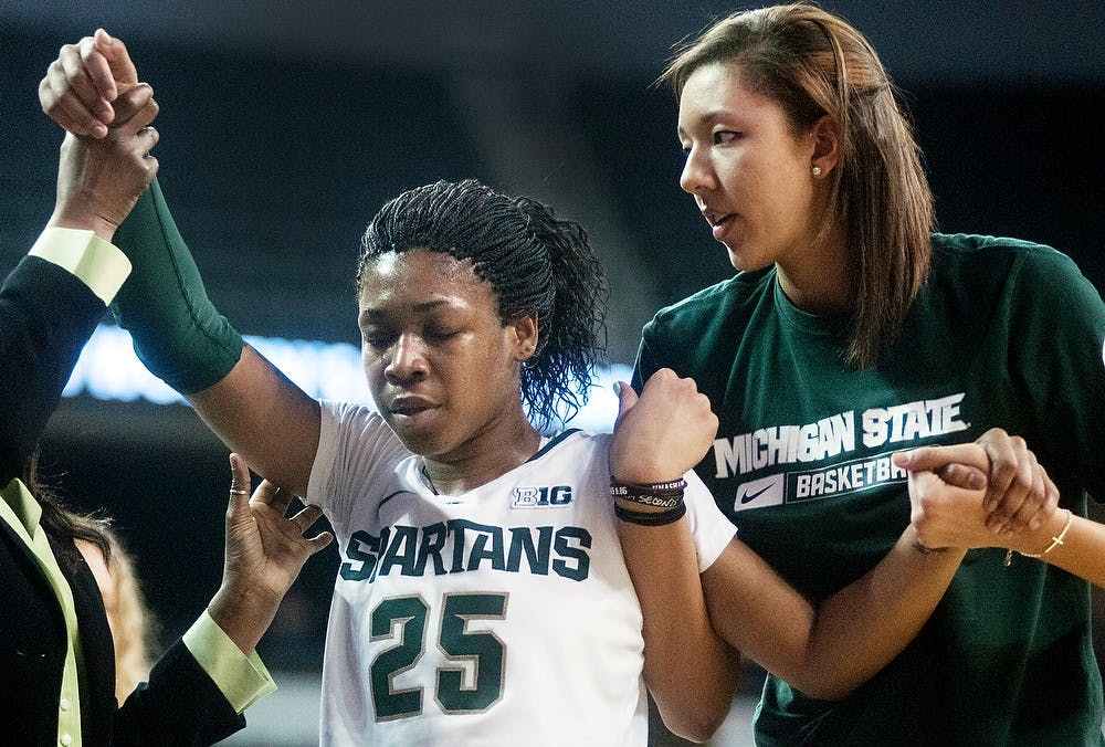 Freshman forward Akyah Taylor is taken off the court after an injury during the quarterfinals of the Big Ten Tournament against Michigan on March 8, 2013, at Sears Centre in Hoffman Estates, Ill. Taylor was sent to the hospital. Julia Nagy/The State News