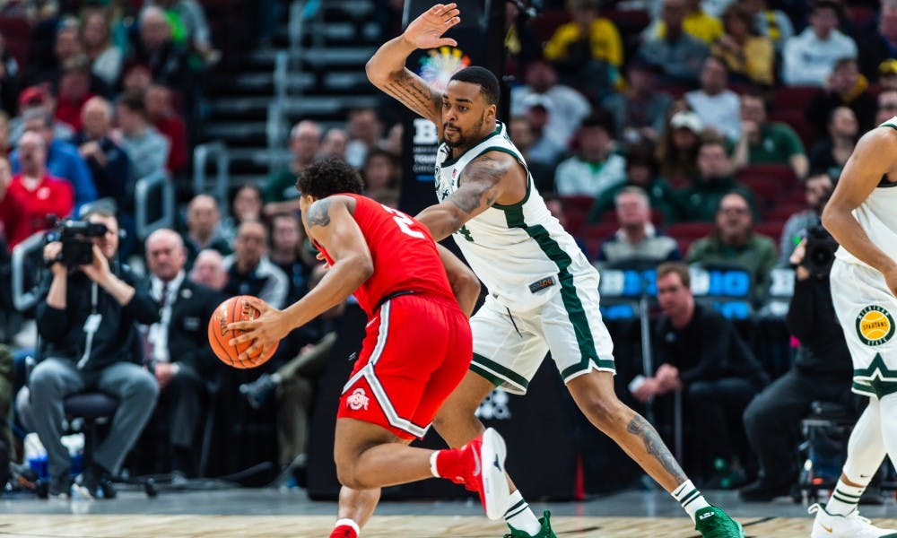 <p>Junior forward Nick Ward guards Ohio State&#x27;s Musa Jallow. The Spartans beat the Buckeyes, 77-70, at the United Center on March 15, 2019.</p>