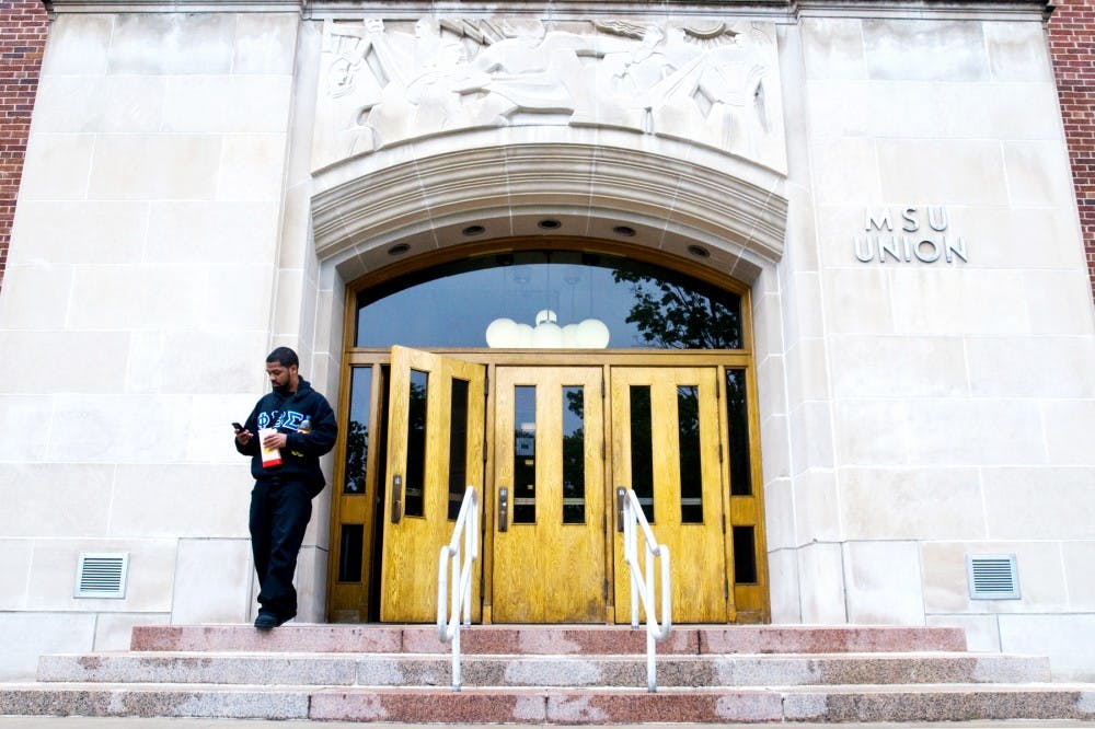 	<p>Education and kinesiology junior Deondre Scott checks his phone as he walks out of the Union Thursday afternoon. The building was opened in 1925 and has since been a social hub for <span class="caps">MSU</span> students.</p>