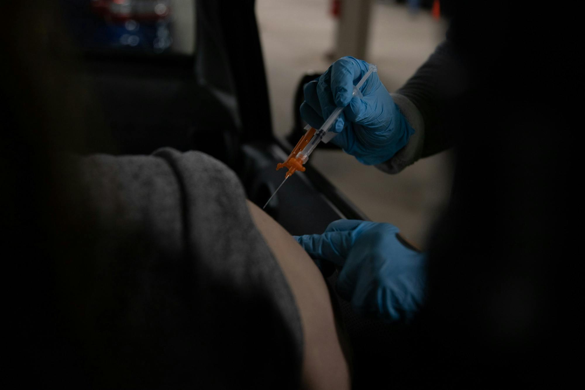<p>A student receiving their vaccine at the Michigan State University, or MSU Pavilion on April 15, 2021.</p>