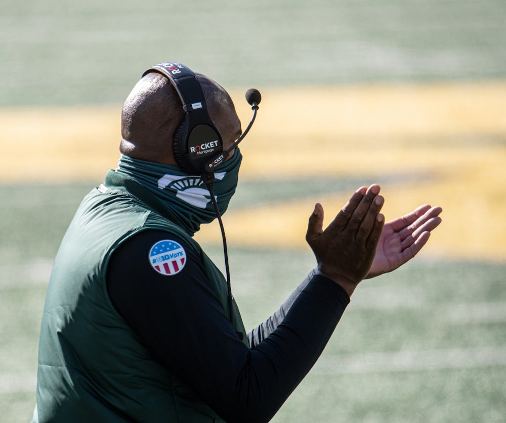 MSU head coach, Mel Tucker, applauds after his offense scores a touchdown in the first half of the game against U of M in Ann Harbor, MI on Oct. 31, 2020.