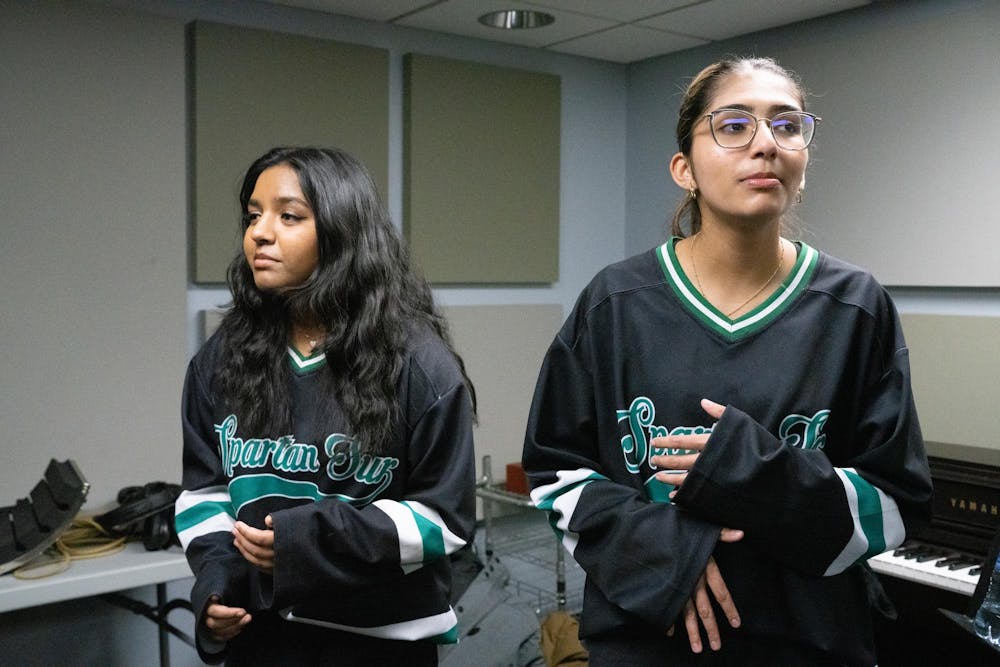 <p>Members of Michigan State University’s A Cappella group, Spartan Sur practices during a rehearsal in Sny-Phi on April 3, 2024.&nbsp; </p>