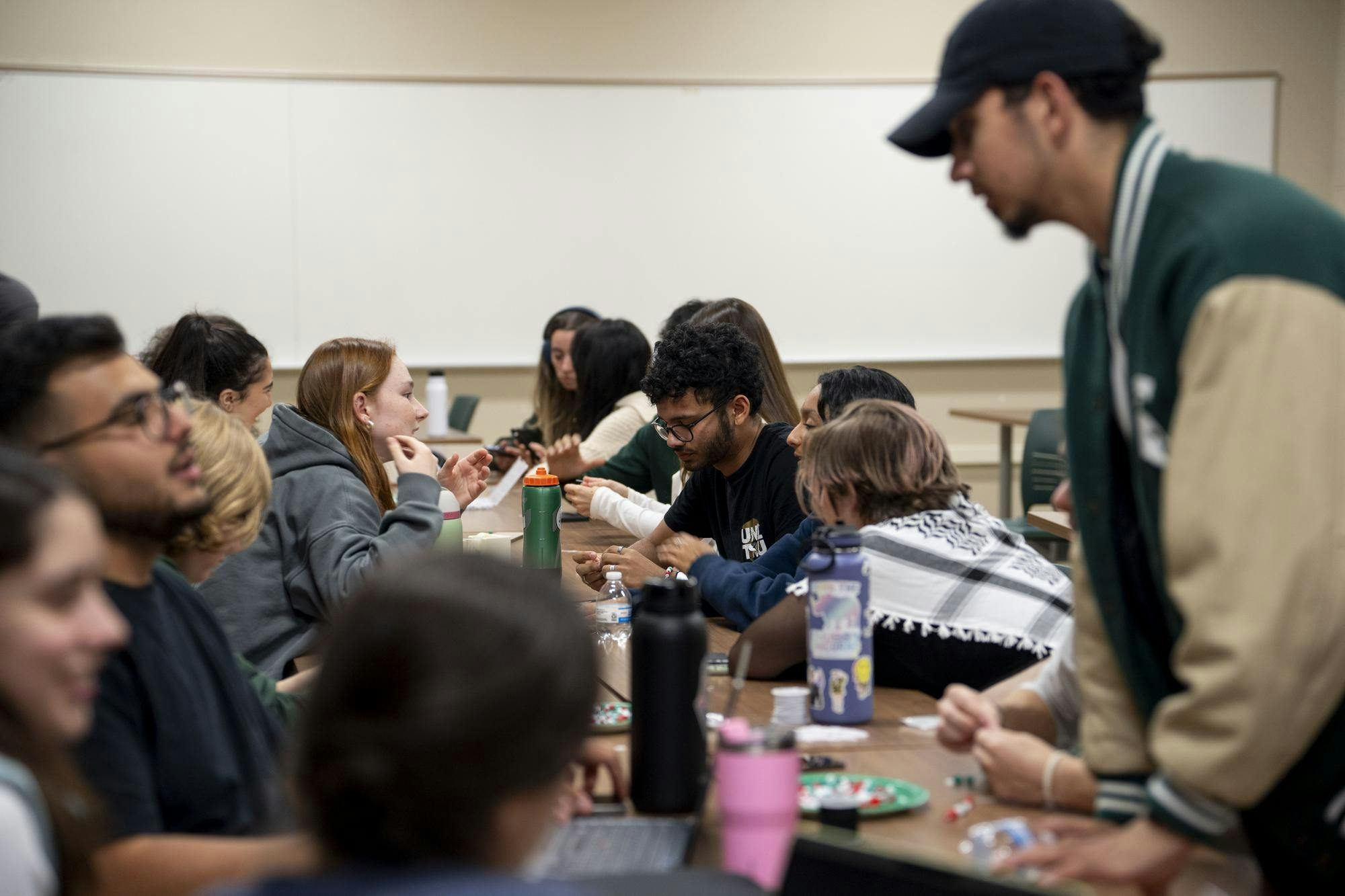 <p>Members of the Lebanese Student Association gather together to make bracelets for Lebanon during a special event on Oct. 2, 2024.</p>